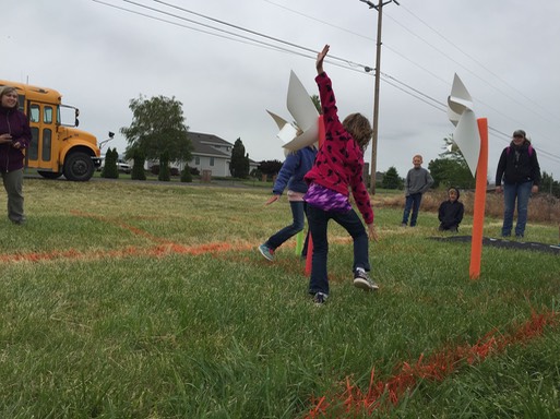 wind turbines & cars on a road